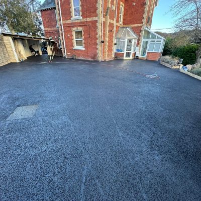 Newly constructed tarmac driveway with clean finish, completed by iGroup South West Ltd